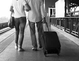 Senior couple traveling train station