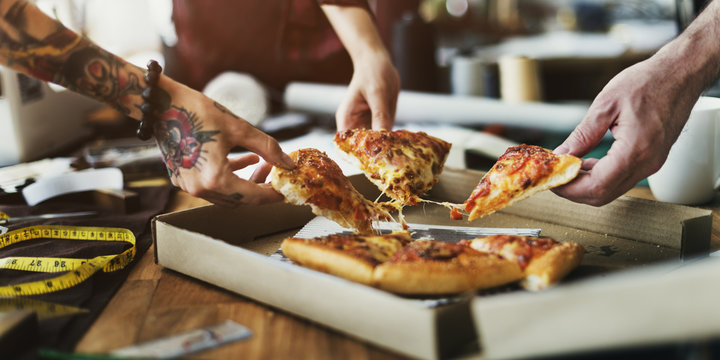 Eating Pizza. Group Of Friends Sharing Pizza Together. People Hands Taking  Slices Of Pepperoni Pizza. Fast Food, Friendship, Leisure, Lifestyle. Stock  Photo