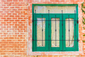 Obraz premium vintage style house wooden windows on brick wall. cottage home.