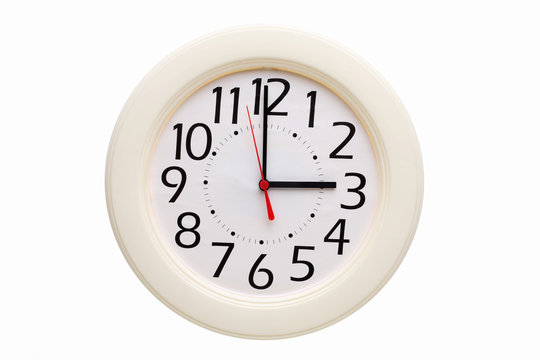 Analog wall clock showing three o'clock