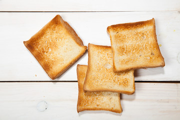 Toast bread on a white wooden background