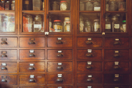 old herbal medical shop retro Chinese style seasoning collection wood cabinet in herb store.