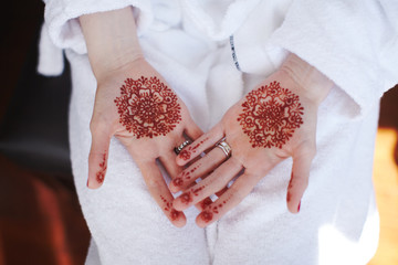 Beautiful henna patterns on hands of bride