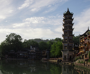 Photo of Old Asian Pagoda Temple on Blue Sky Background. Buddhism Religion Center
