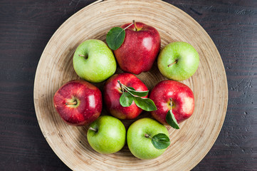 apples. with lives. wooden background