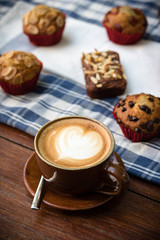 White cup of coffee on vintage wood. Top view , cup on wooden ta