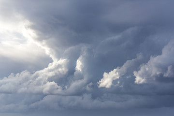 Stormy clouds with sunshine. Rainy weather