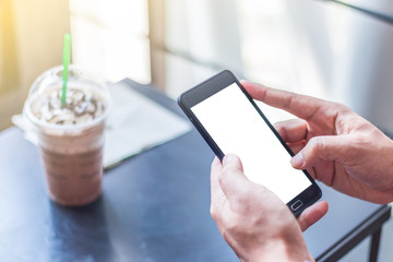 The human hands holding the smartphone and touch on mobile scree