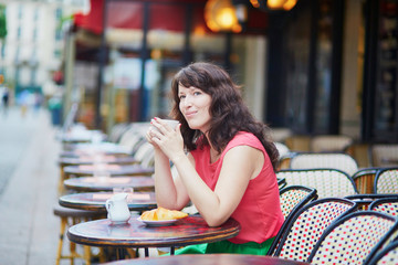 Woman drinking coffee in cafe
