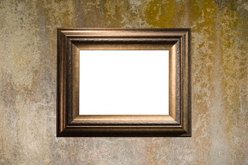 Blank golden frame on dirty cement wall