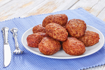 juicy delicious meat cutlets on white plate