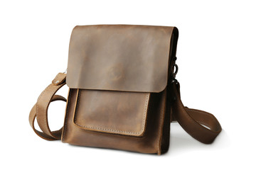 Brown leather bag on white background