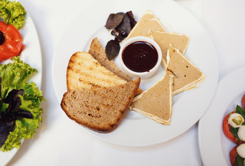 Plate with the canapes on the wedding table