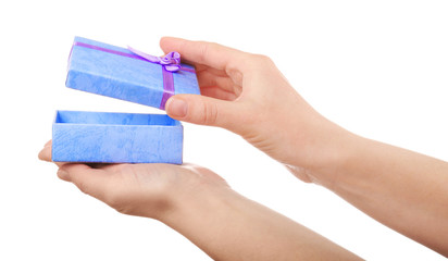 Female hands holding gift box, closeup