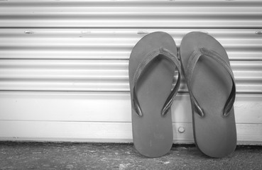 black flip flop sandals on background,black and white tone