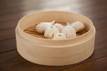 Fototapeta na wymiar Dumplings in bamboo steamer