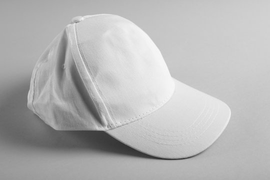 Blank baseball cap on grey background