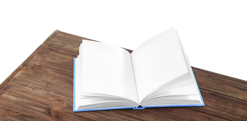 Opened book on wooden table
