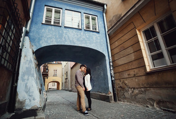 Fototapeta na wymiar Romantic kiss in the empty alley