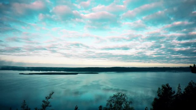 Fog over lake in the morning. Timelapse