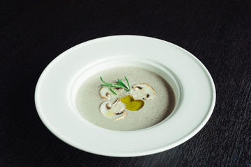 Cream of mushroom soup with olive oil and sliced mushrooms