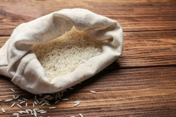Bag of rice on wooden table