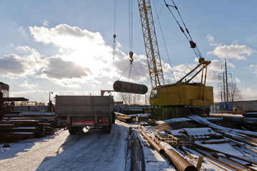 Fototapeta na wymiar The finished shell of the heat exchanger unload the crane
