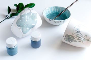 painted ceramic cup on white background