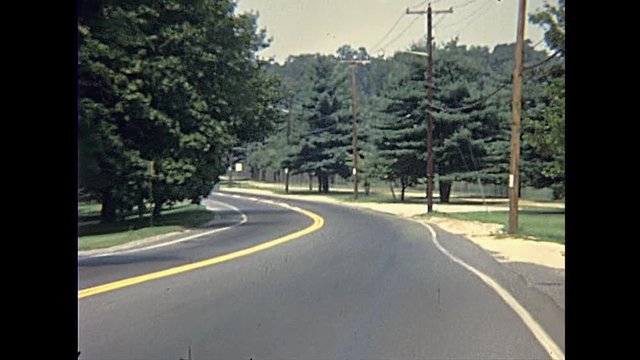 road to Old Bethpage Village Restoration, living history museum about Long Island life during 19th century. Vintage footage. circa 1970:
