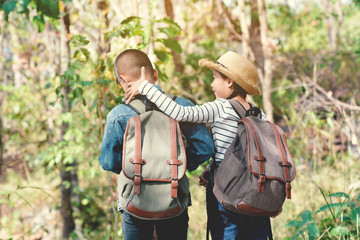 Happy Asian children backpack in nature background, Relax time on holiday
