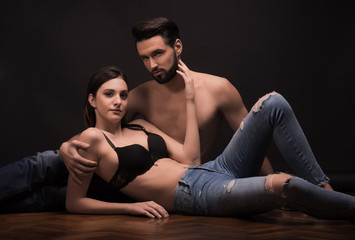 Obraz premium young couple lying laying on floor, sexy, good looking