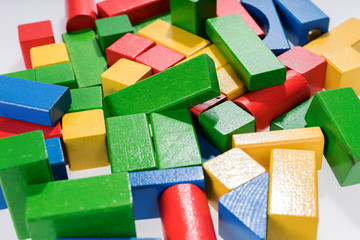 Toys blocks, multicolor wooden building bricks, heap of colorful game pieces