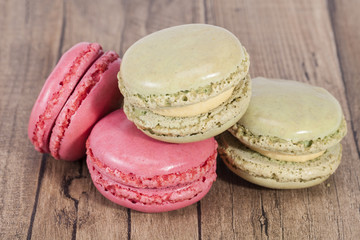 Colorful cookies of macaroon isolated on wooden plank