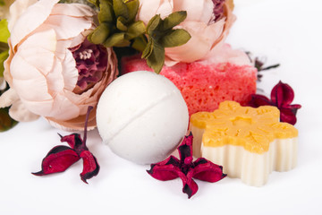 Soap, flowers and bath bomb are isolated on a white background