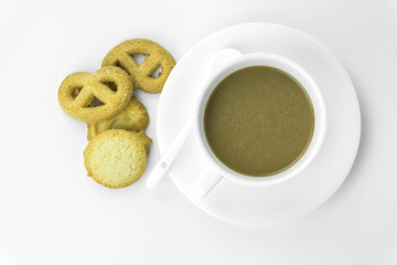 Coffee cup and candy on white background.