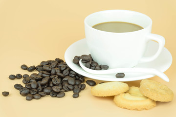 Coffee cup and coffee beans on Orange background.