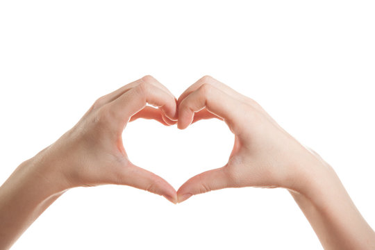 Female hand showing thumbs heart