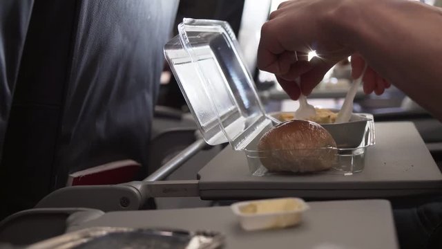 Man eating breakfast at table flying plane stock footage video