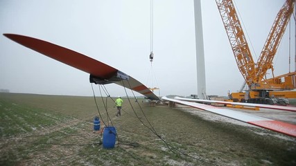 Wind Turbine Element Lifted by a Crane. Time-lapse - Powered by Adobe