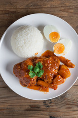 Chicken stew with sauce tomato and egg, rice. Top view.