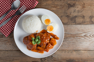 Chicken stew with sauce tomato and egg, rice. Top view.