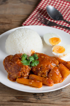 Chicken stew with sauce tomato and egg, rice.