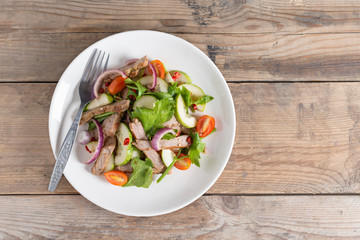Spicy salad of grilled beef, Thai style food.