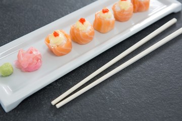 Sushi on tray with chopsticks