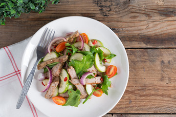 Spicy salad of grilled beef, Thai style food.
