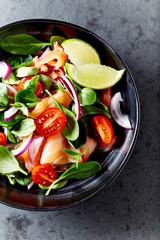 Salmon salad with baby spinach and corn salad