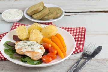 Grilled Chicken steak topping spinach sauce with vegetable and b