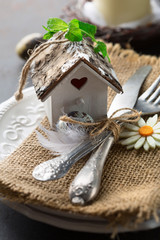Easter table setting on dark retro background. Spring Decorations Concept. Selective focus