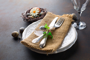 Easter table setting on dark retro background. Spring Holiday Decorations Concept. 