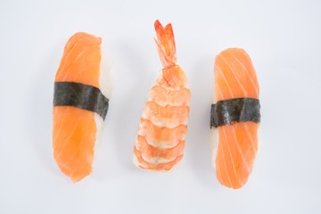 Sushi roll and shrimp on white background